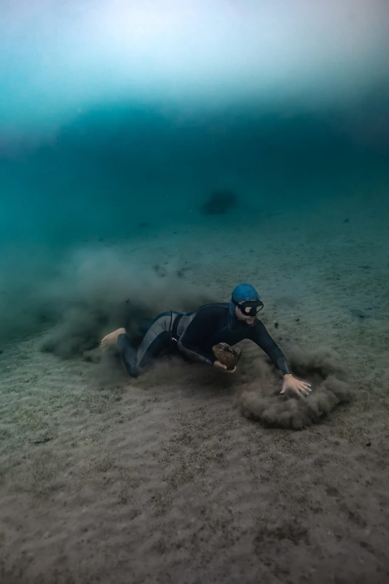 Underwater portrait of a freediver training in a deep pool