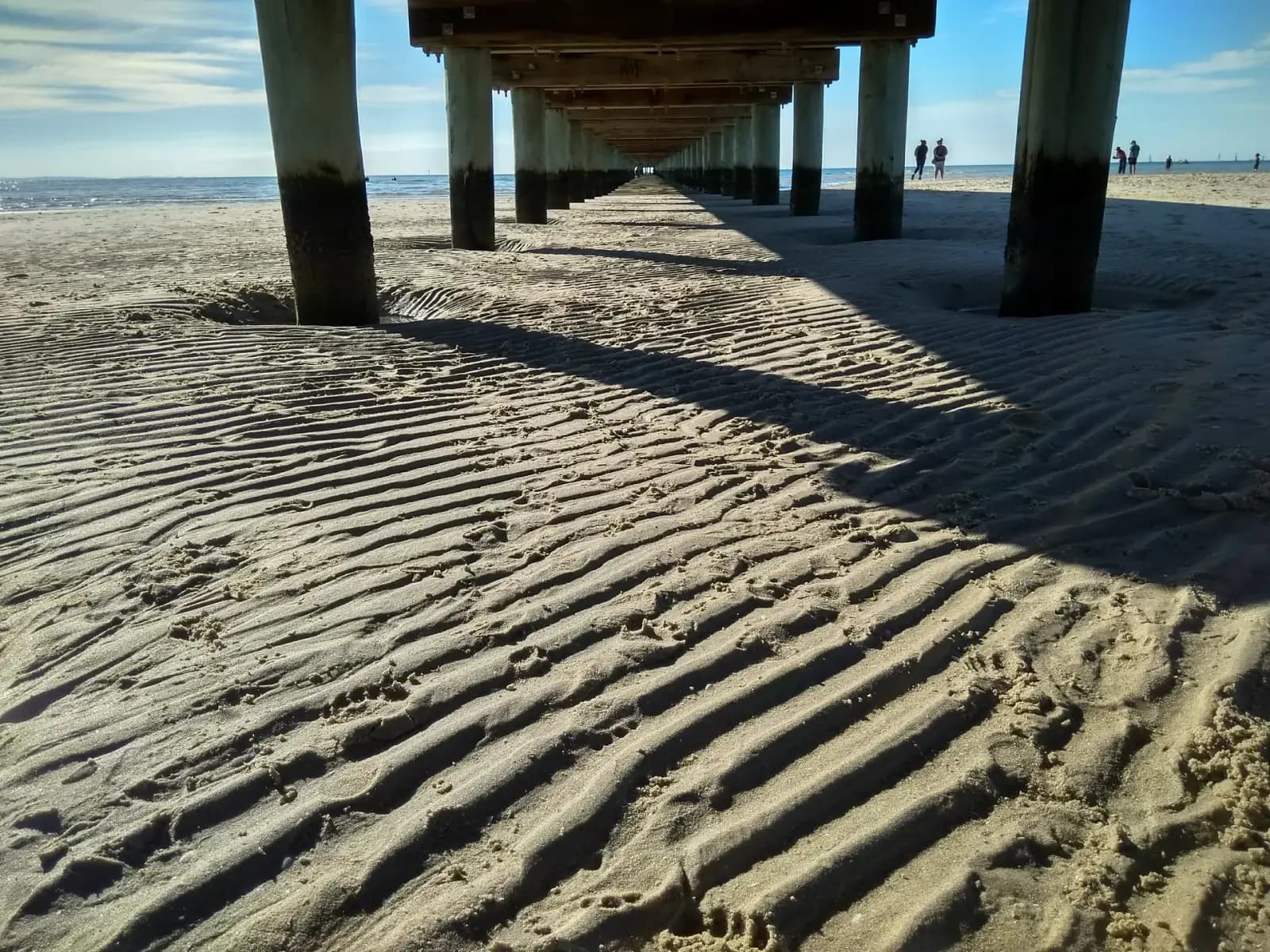 Pier in Rosebud on the Mornington Peninsula at low tide, similar conditions to where wetsuits are needed
